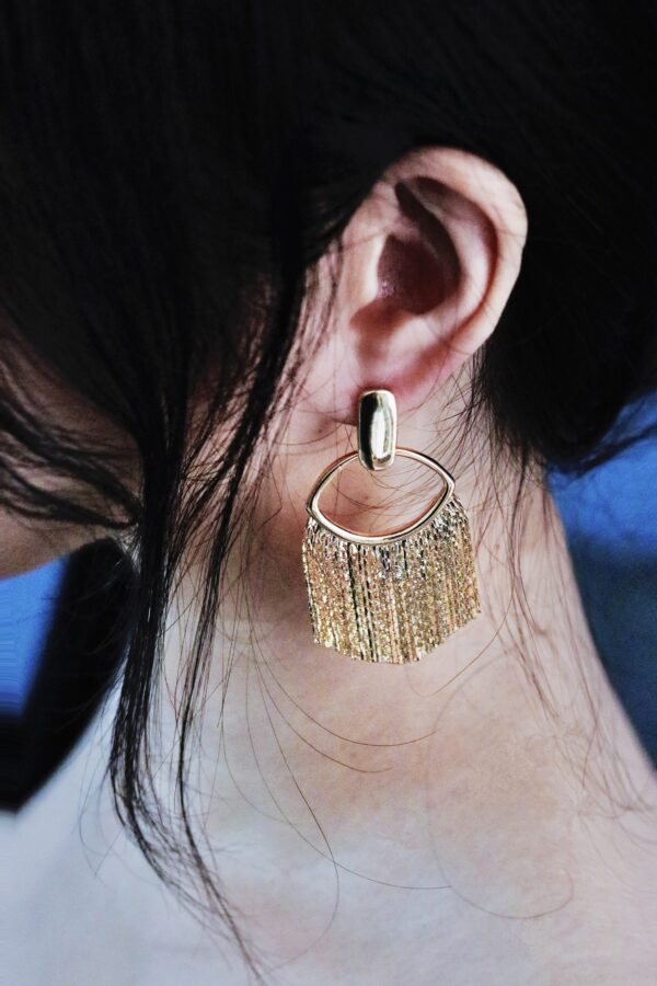 "Watch what happens when candlelight hits these" Golden Tassel Earrings