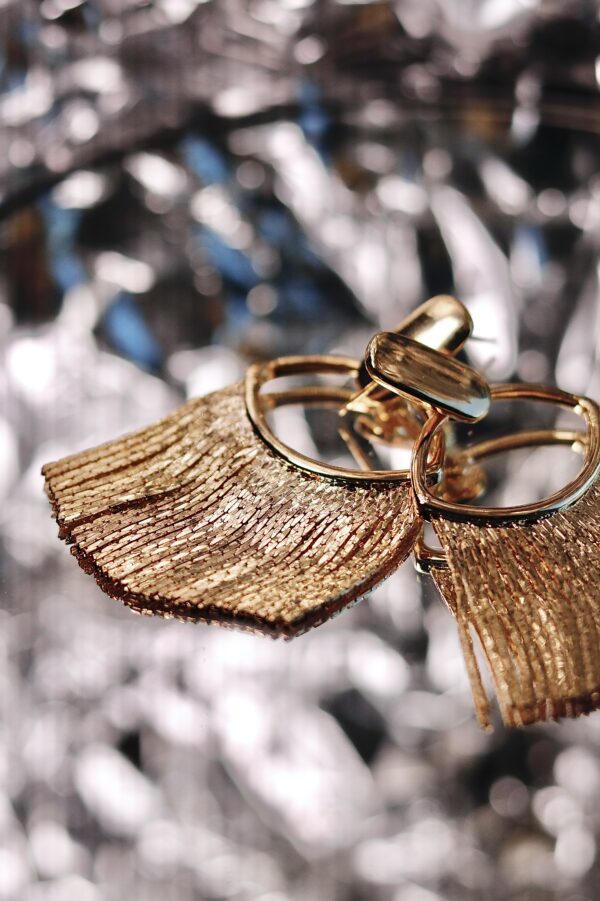 "Watch what happens when candlelight hits these" Golden Tassel Earrings - Image 3